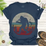 Bigfoot Fishing Graphic T-Shirt — Retro Sunset Sasquatch Tee - blue