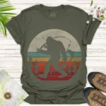 Bigfoot Fishing Graphic T-Shirt — Retro Sunset Sasquatch Tee - green